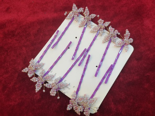 圖為串珠米珠繡純手工產(chǎn)品剪影 圖為串珠米珠繡純手工產(chǎn)品剪影